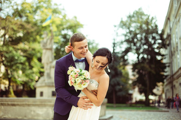 Portrait of young bride and groom at happy wedding day