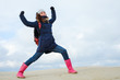 © skvalval - energetic funny young woman enjoying life and posing on on winter beach. energy, strength, power, success concept