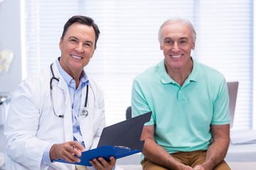 Wall Mural - Portrait of smiling doctor and senior patient