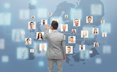 Wall Mural - businessman using virtual screen with contacts