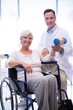 © WavebreakMediaMicro - physiotherapist assisting senior patient with hand