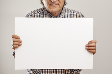 Senior man hands holding cardboard