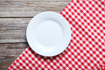 Wall Mural - Empty plate with napkin on grey wooden table