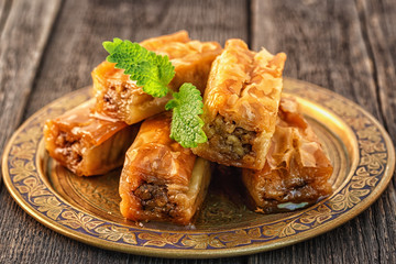 Wall Mural - Traditional arabic dessert Baklava with honey and walnuts.