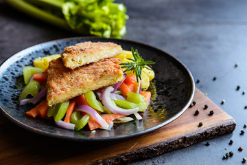 Wall Mural - Breaded kale leaves stuffed with cheese, served with steamed vegetable