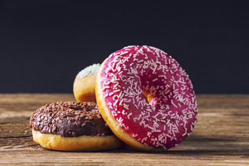 Glazed doughnuts composition closeup