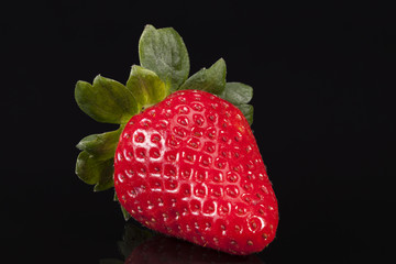 Wall Mural - Fresh fruits of red strawberry isolated on black background