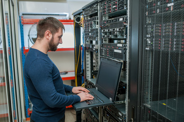 network engineer working in server room