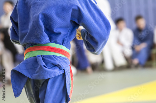 Fotografie, Obraz Young judoka in kimono fight on tatami in gym