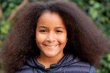 Wall Mural - Pretty girl with long afro hair with a blue coat