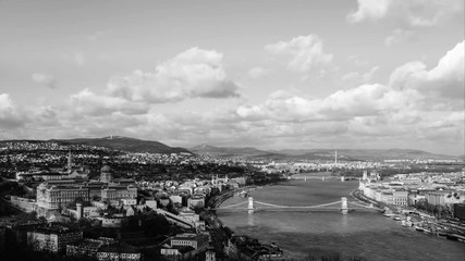 Sticker - Aerial view of Budapest, Hungary with clouds running at a fast pace. Buda castle, Chain bridge and Parliament building. Time-lapse in black and white