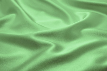 Poster - Green satin fabric as background