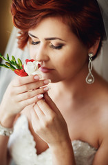 Wall Mural -  charming bride enjoys fresh roses