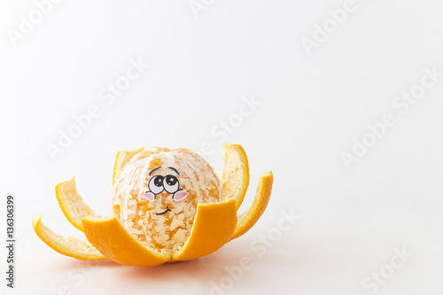 Fotografie, Obraz A half peeled tangerine in front of white background with a funny blushing face