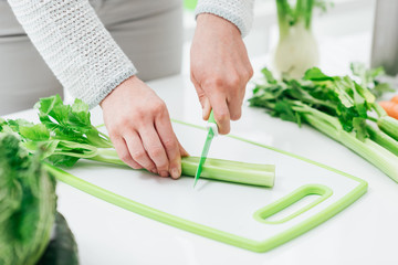 Woman chopping celery