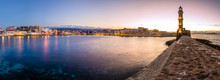 Panorama Of The Beautiful Old Harbor Of Chania With The Amazing Lighthouse, At Sunset, Crete, Greece.