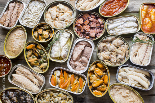 Fotomural Assortment of cans of canned with different types of fish and seafood,
