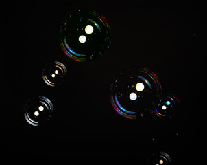 Soap bubbles on black background