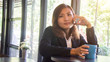 © supatthanan - Woman use of smart phone in coffee shop