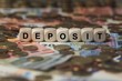 deposit - cube with letters, money sector terms - sign with wooden cubes