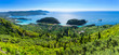Beautiful summer panoramic seascape. View of the coastline into the sea bays with crystal clear azure water. In the backlight sunbeam light. Paleokastrica. Corfu. Ionian archipelago. Greece.