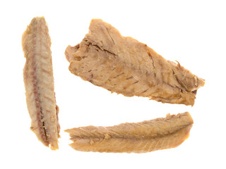 Three mackerel skinless fillets isolated on a white background.