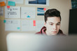 © ZeroThree - Young man working on his computer