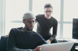 © ZeroThree - Two men watching a laptop