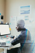 © ZeroThree - African American Man Working At His Desk