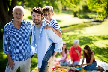 Wall Mural - Happy family enjoying in park