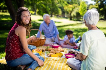 Wall Mural - Happy family enjoying in park