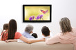 © Africa Studio - Family watching television at home. Leisure and entertainment concept.