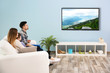 © Africa Studio - Family watching television at home. Leisure and entertainment concept.