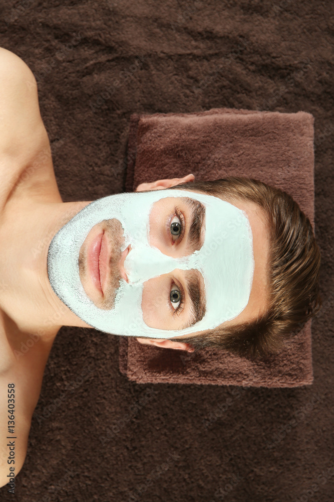 Man having cosmetic mask in spa salon