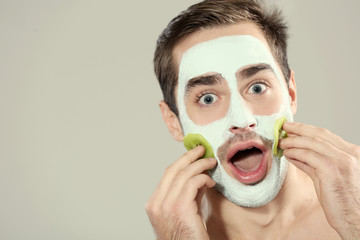 Canvas Print - Man with cosmetic mask on face, light background