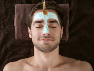 Wall Mural - Man having cosmetic mask in spa salon