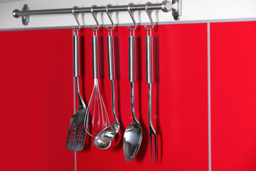 Wall Mural - Set of metal kitchen utensils hanging on wall