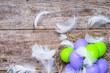 Traditional easter eggs in nest on wooden background