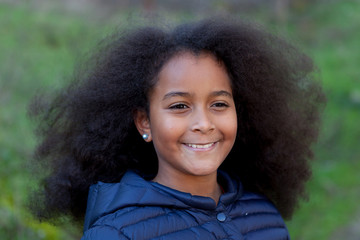 Wall Mural - Pretty girl with long afro hair in the garden