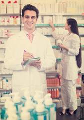 Wall Mural - pharmacists  posing in drugstore