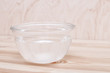 water in a bowl on a wood background