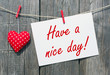 © DOC RABE Media - Have a nice day - red heart with postcard and text on wooden background