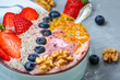 Breakfast smoothie berry bowl with chia, passion fruit and nuts. Clean eating, vegetarian, raw, detox, dieting concept