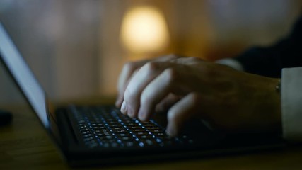 Aufkleber - Close-up of Man's Hands Typing on a Laptop. In the Background Warm and Homely Atmosphere. Shot on RED EPIC-W 8K Helium Cinema Camera.