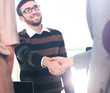 © ASDF - Business people closing a deal and handshaking at the office