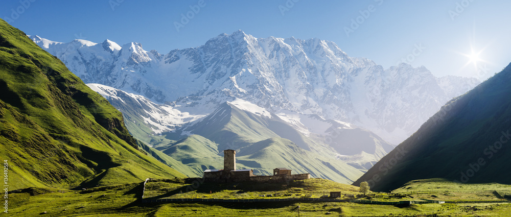 Church at the foot of the Caucasus Mountains - obrazy, fototapety, plakaty 