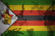 Flag Of Zimbabwe On The Khaki Texture . Military Concept