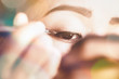 closeup women use the eye eyeliner.
