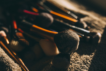 Close up of a pile of make up brushes