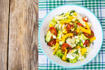 Fresh vegetable salad with olive oil